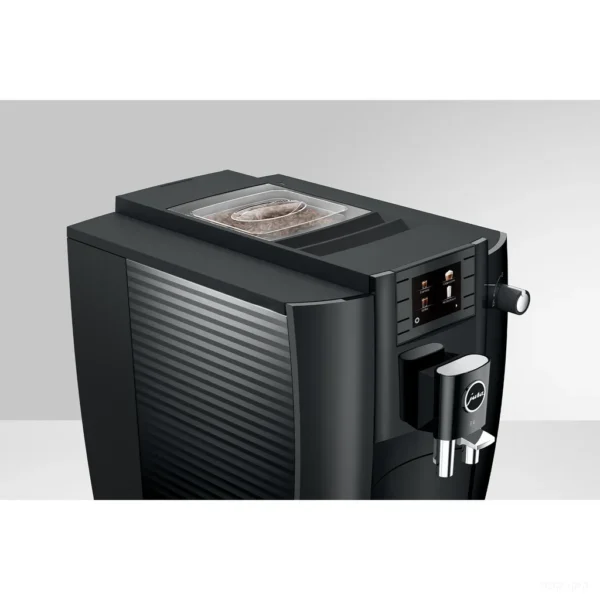 מכונת קפה אוטומטית Jura E6 Piano Black, מבט עליון על מיכל הפולים בנפח 280 גרם ועל פיית המזיגה